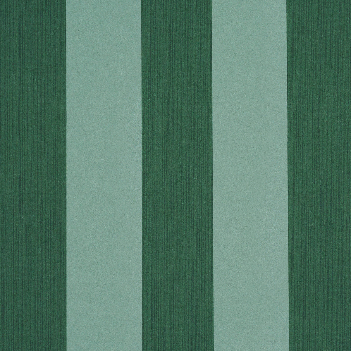 Edwin Stripe Wide wallpaper in dark green by Schumacher, featuring bold vertical stripes and a textured look.