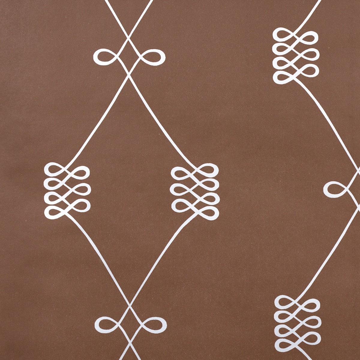 Nicolette wallpaper in silver on brown, featuring a swirling trellis motif by Schumacher.
