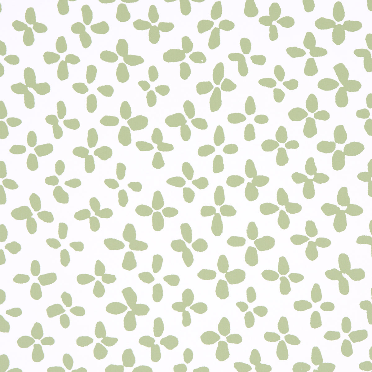 Emerson green-on-ivory small-scale quatrefoil print wallpaper by Schumacher, shown in close-up, roll, and room setting.