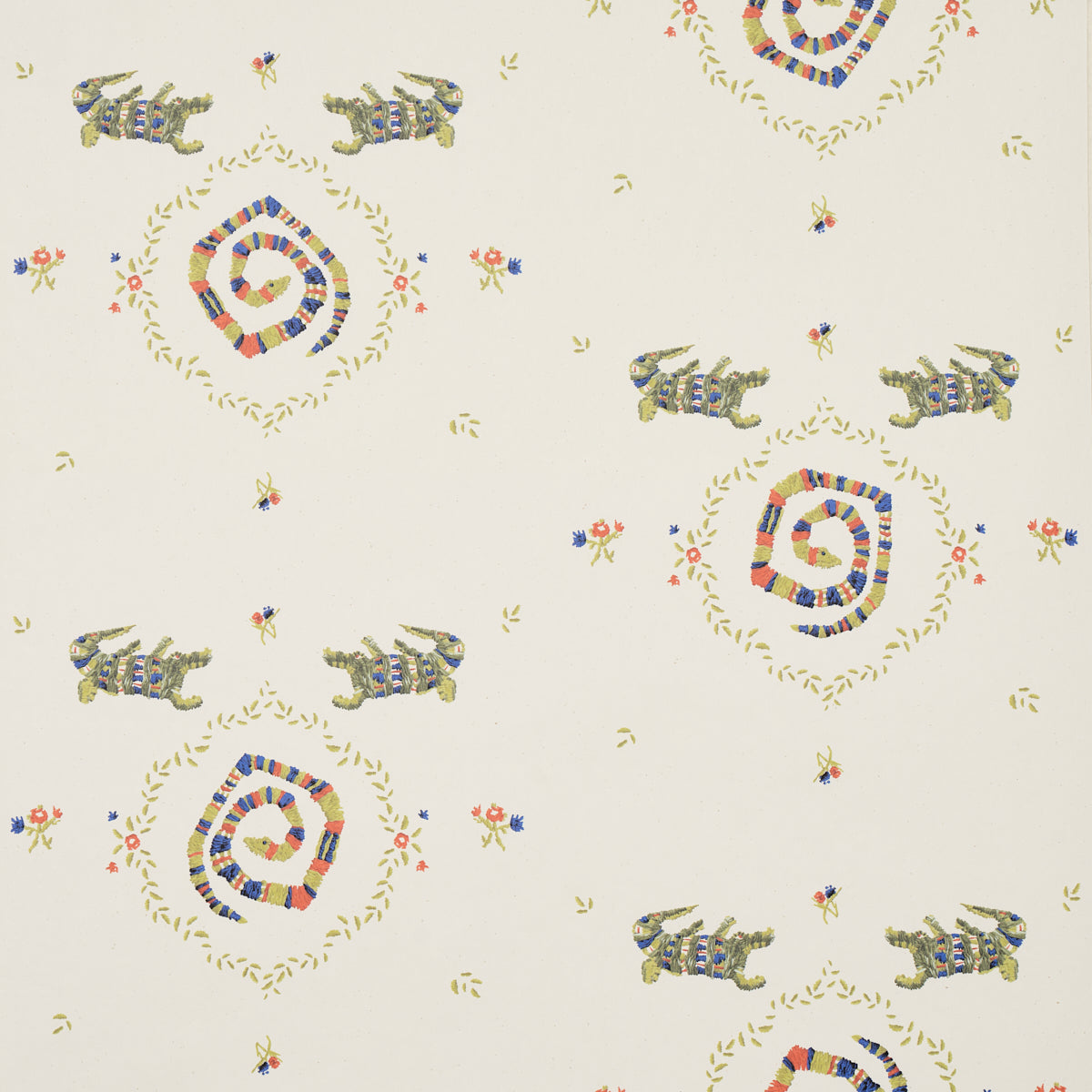 Reptilia wallpaper by Schumacher featuring playful embroidered alligators, snakes, and swamp plants in bright multi colors on a cream background.