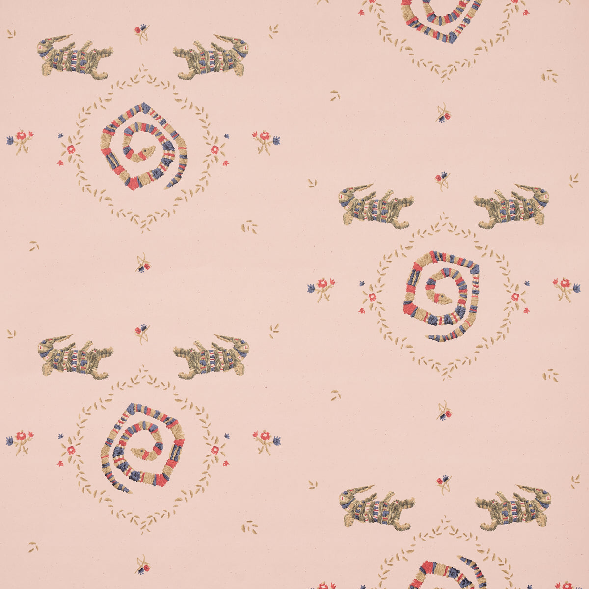 Reptilia wallpaper in muted pink with playful embroidered alligators, snakes, and floral motifs by Schumacher
