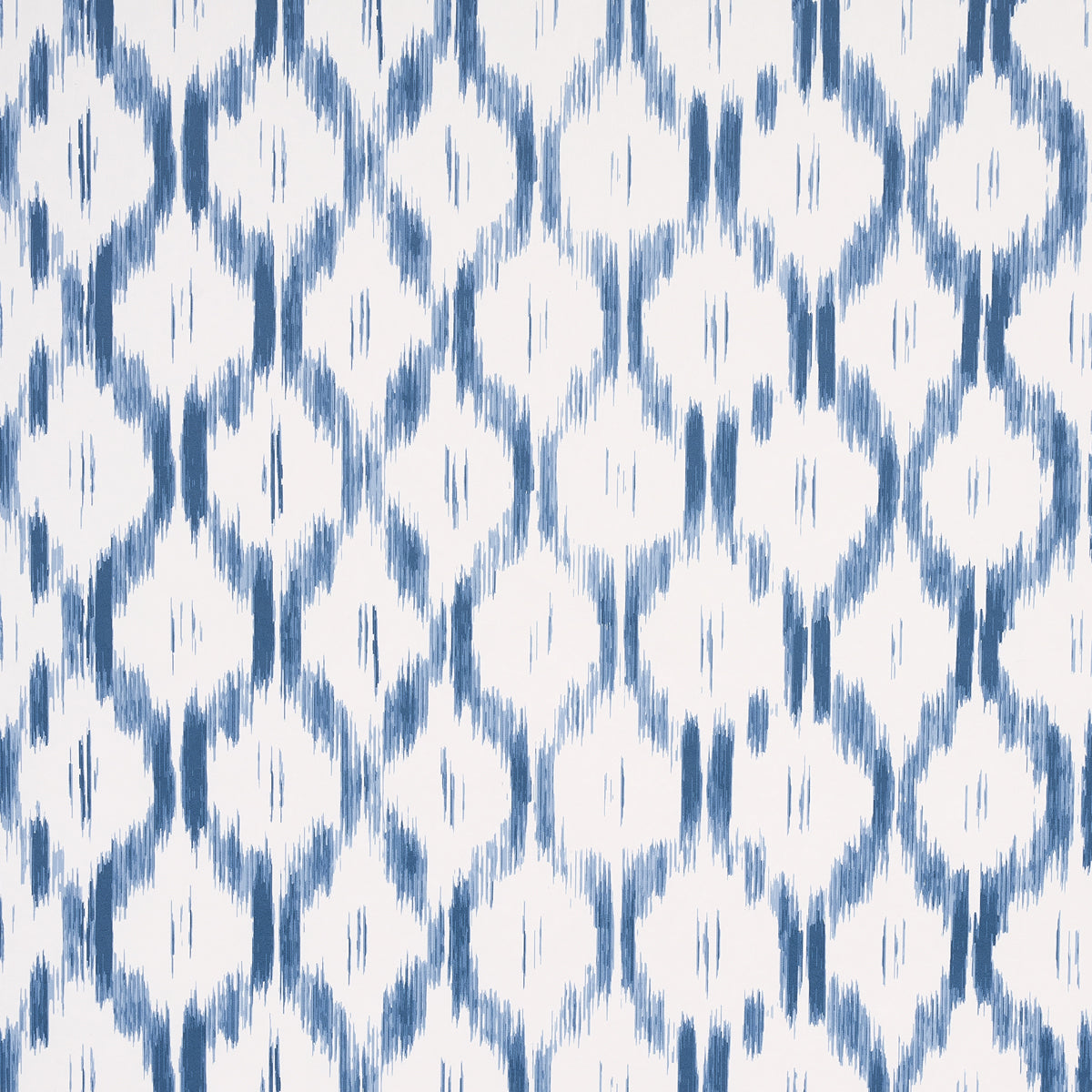 Santa Monica Indigo by Mark D. Sikes for Schumacher - blue and white ikat-inspired wallpaper in a bedroom setting