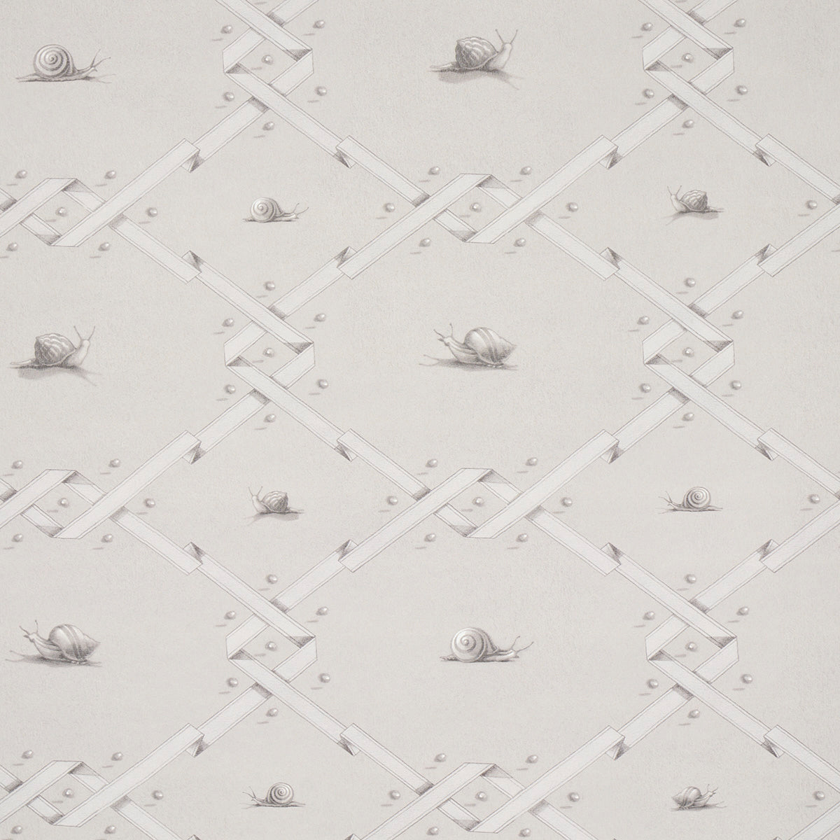 Ouvrez Moi wallpaper in grey by Schumacher, featuring a trompe l'oeil ribbon lattice with snails and pearl details, designed by Charlap Hyman & Herrero.