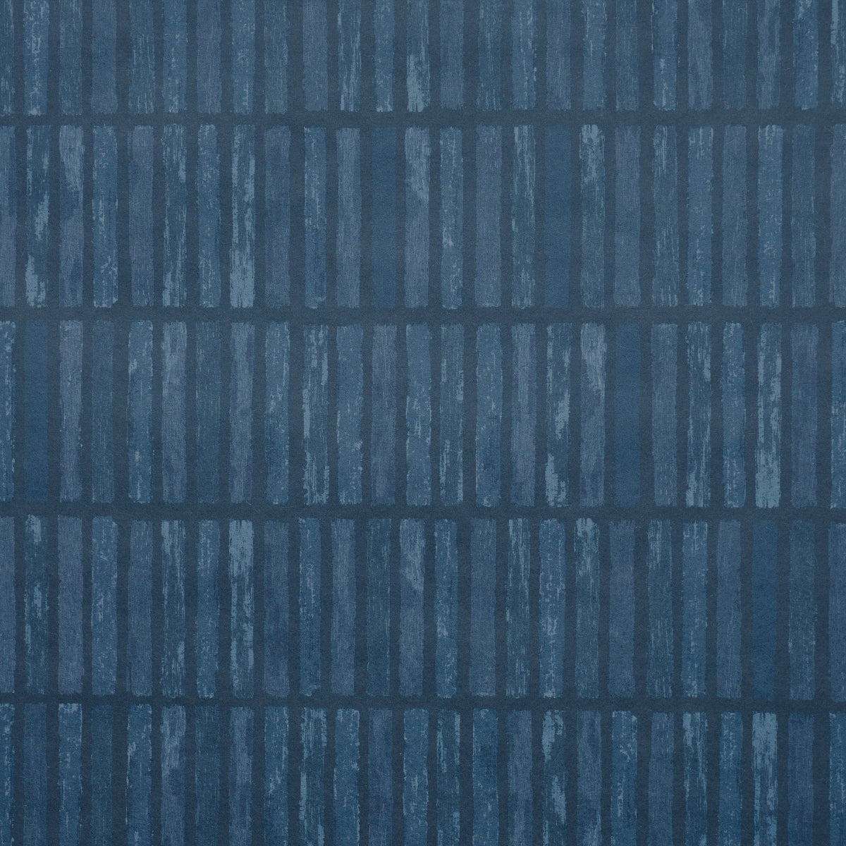 Wabi-Sabi dark blue geometric grid wallpaper by Schumacher, hand-painted look, styled in a modern kitchen interior.