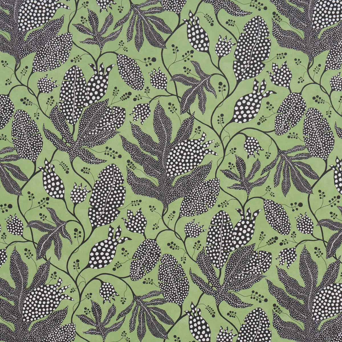 Polka Dot Jungle wallpaper by Marian McEvoy for Schumacher, featuring a large-scale botanical pattern in black and green.