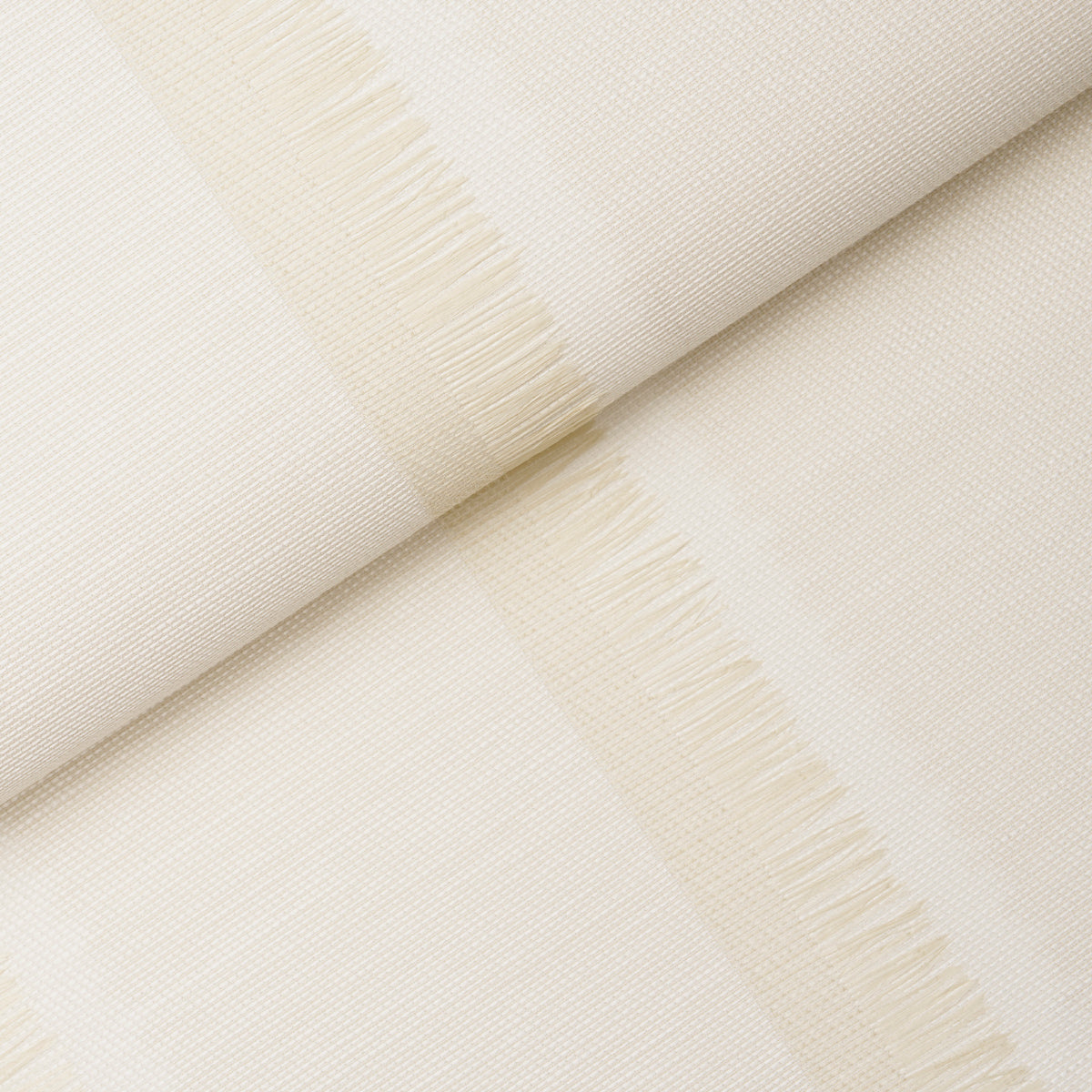Axel Fringe Wallcovering in Parchment by Schumacher, a large-scale vertical stripe wallpaper with fringe detail and textured finish.