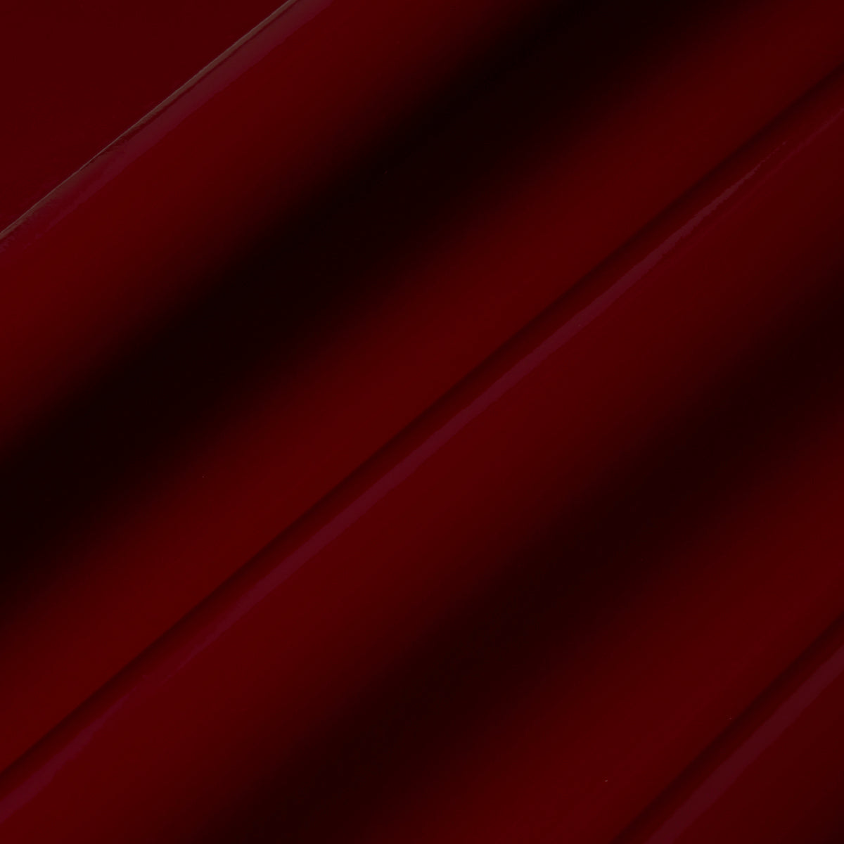 ACE FAUX LACQUER PERFORMANCE VINYL in maroon, a glossy, high-performance vinyl wallcovering by Schumacher, shown in a luxurious interior setting.