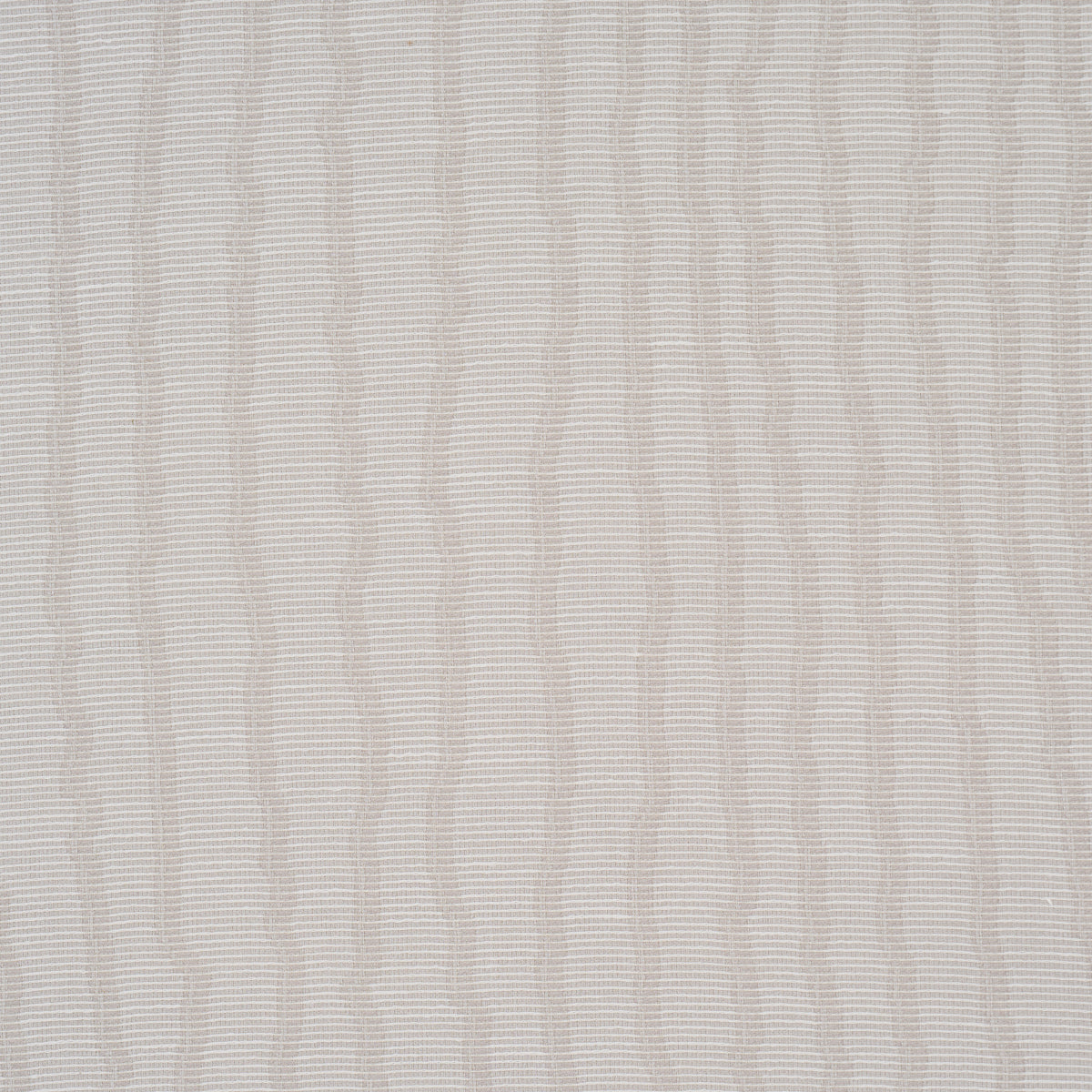 La Voie Wallcovering in Fog by Schumacher, a woven jacquard wallpaper with organic striping, shown in a modern bedroom setting.