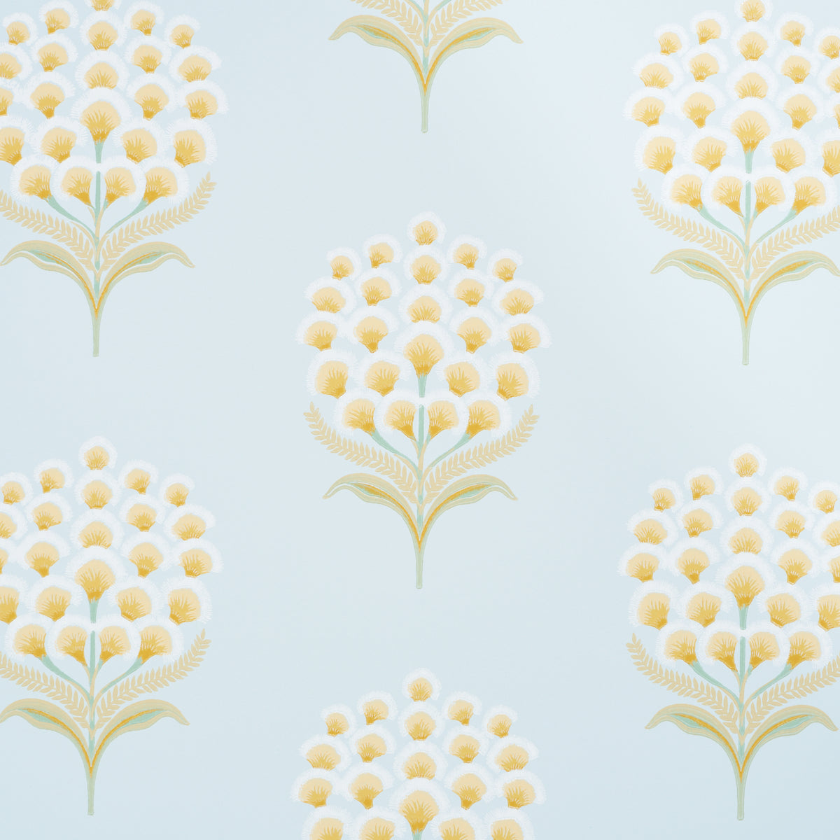 Aurelia Sky wallpaper by Schumacher featuring large stylized yellow and white blossoms on a soft blue background, shown in a bathroom setting.