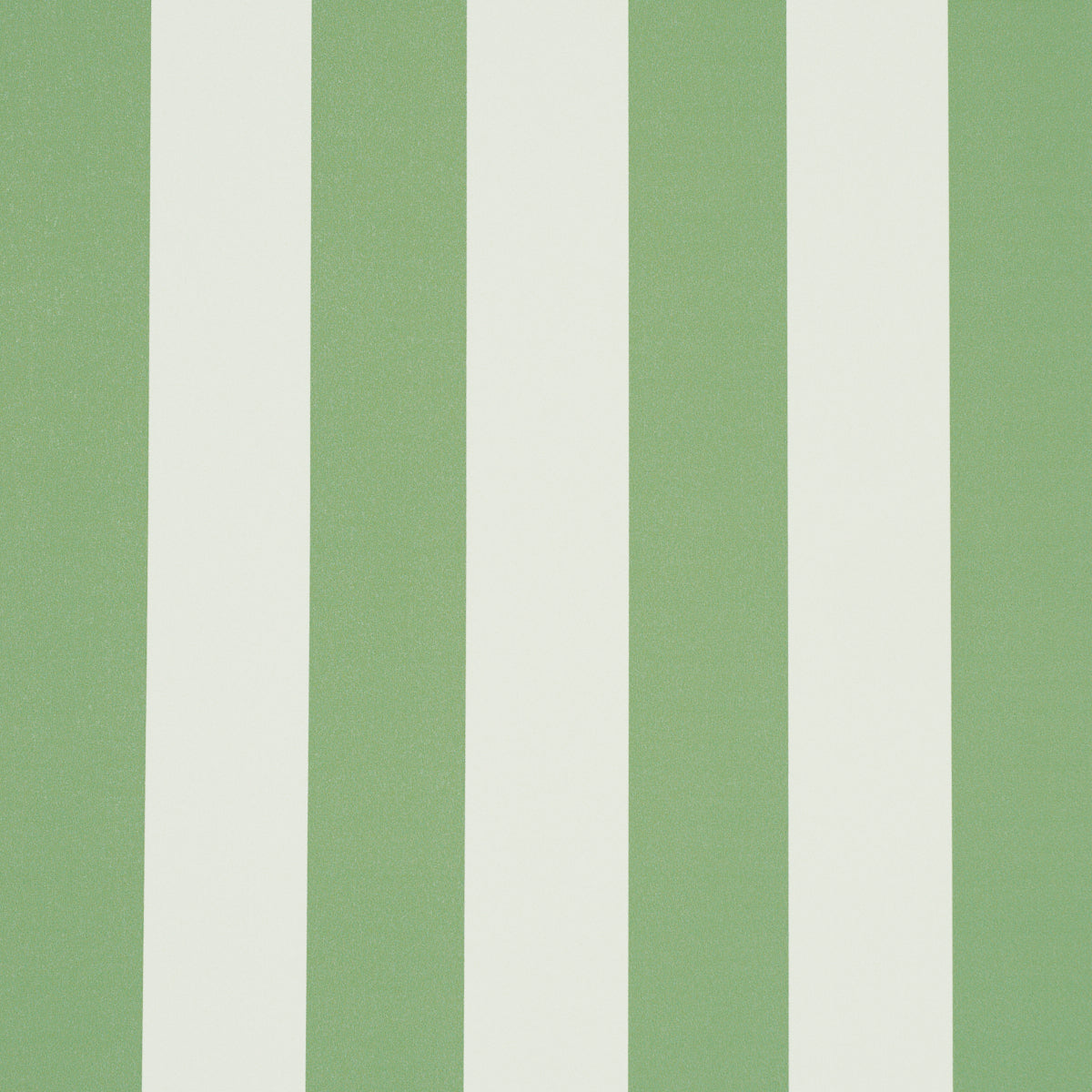 Emma Stripe wallpaper in Apple Green by Schumacher, featuring bold vertical green and white stripes, shown in a styled bathroom interior.
