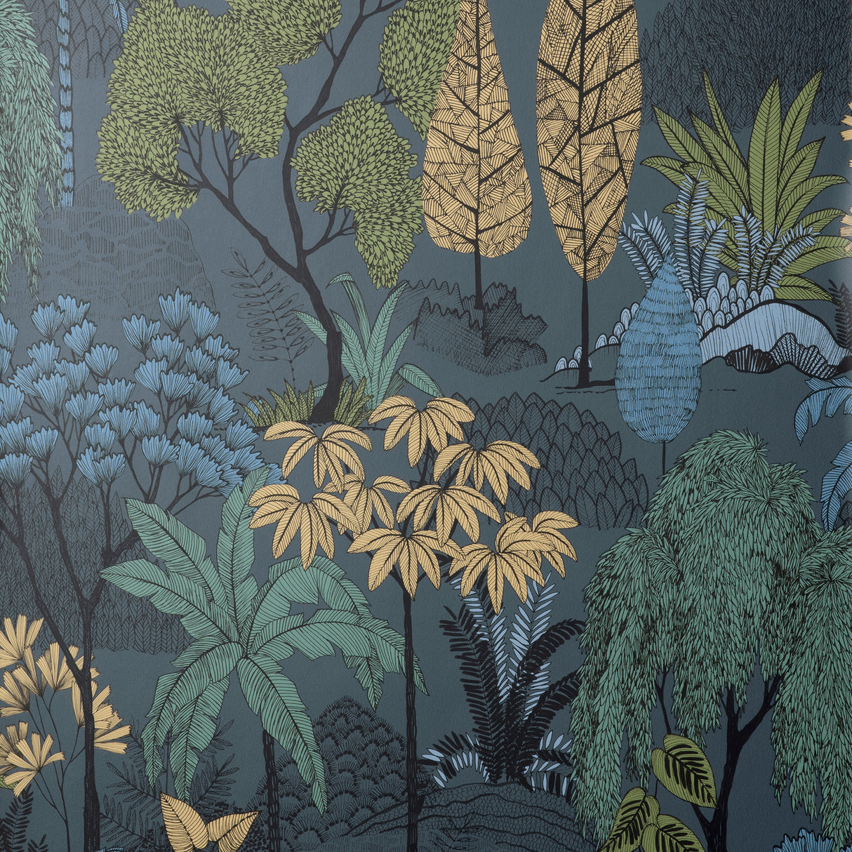 Fine Decor Lilou Navy Tropical Island Wallpaper detail showing tropical trees and foliage on denim-blue ground
