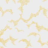 Molntuss yellow polka-dot cloud wallpaper by Boråstapeter for Schumacher, styled in a modern entryway