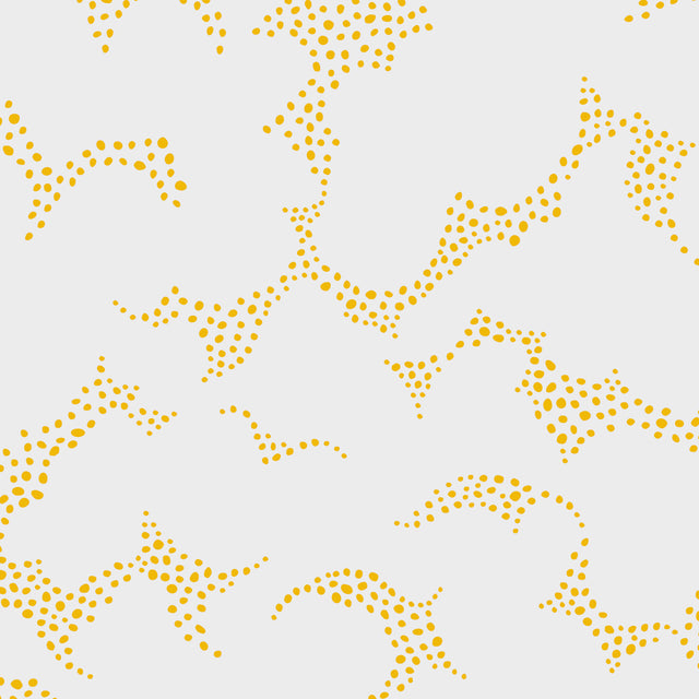 Molntuss yellow polka-dot cloud wallpaper by Boråstapeter for Schumacher, styled in a modern entryway