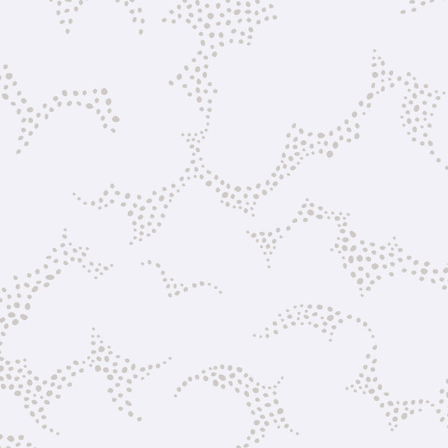 Molntuss grey wallpaper by Boråstapeter for Schumacher, featuring playful cloud and polka-dot design in a modern bedroom setting.