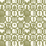 Fruktlåda olive green fruit and foliage print wallpaper by Boråstapeter for Schumacher, shown in a Scandinavian kitchen interior.