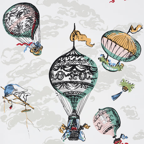 Colorful hot air balloons and clouds on a whimsical wallpaper design by Schumacher.