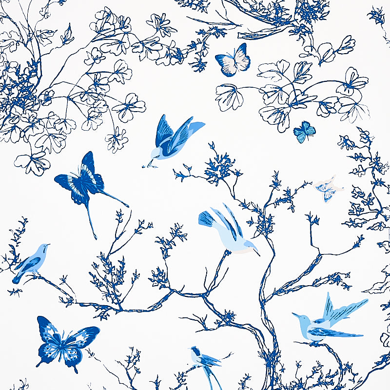 Porcelain blue and white wallpaper featuring birds and butterflies among delicate branches and foliage, Schumacher Birds & Butterflies.