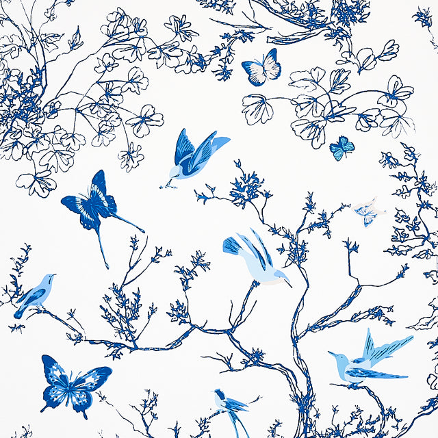 Porcelain blue and white wallpaper featuring birds and butterflies among delicate branches and foliage, Schumacher Birds & Butterflies.