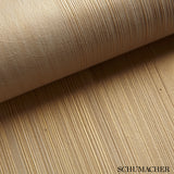 Close-up of Schumacher Casual Brush ivory handcrafted textured wallcovering with horizontal brushstroke pattern.
