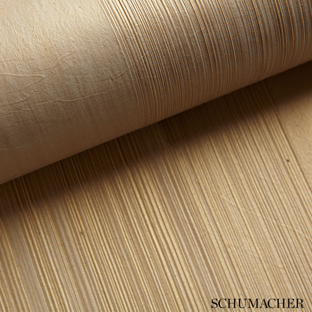 Close-up of Schumacher Casual Brush ivory handcrafted textured wallcovering with horizontal brushstroke pattern.
