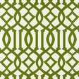 Imperial Trellis wallpaper in Treillage green by Kelly Wearstler for Schumacher, featuring a bold geometric trellis pattern on walls in a bright interior.