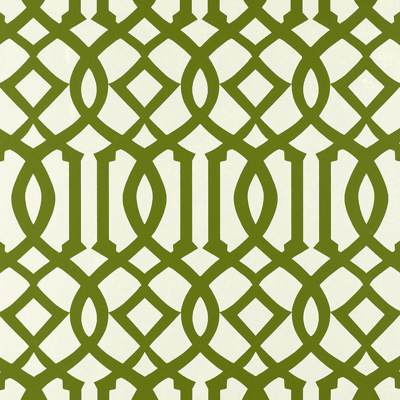 Imperial Trellis wallpaper in Treillage green by Kelly Wearstler for Schumacher, featuring a bold geometric trellis pattern on walls in a bright interior.