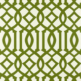 Imperial Trellis wallpaper in Treillage green by Kelly Wearstler for Schumacher, featuring a bold geometric trellis pattern on walls in a bright interior.