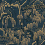 Indigo Garden wallpaper by Boråstapeter for Schumacher, featuring indigo and gold rolling hills, willow trees, and rippling water.