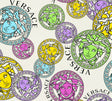 Versace Dynasty wallpaper in Confetti colorway featuring multicolor Medusa medallions on a light background