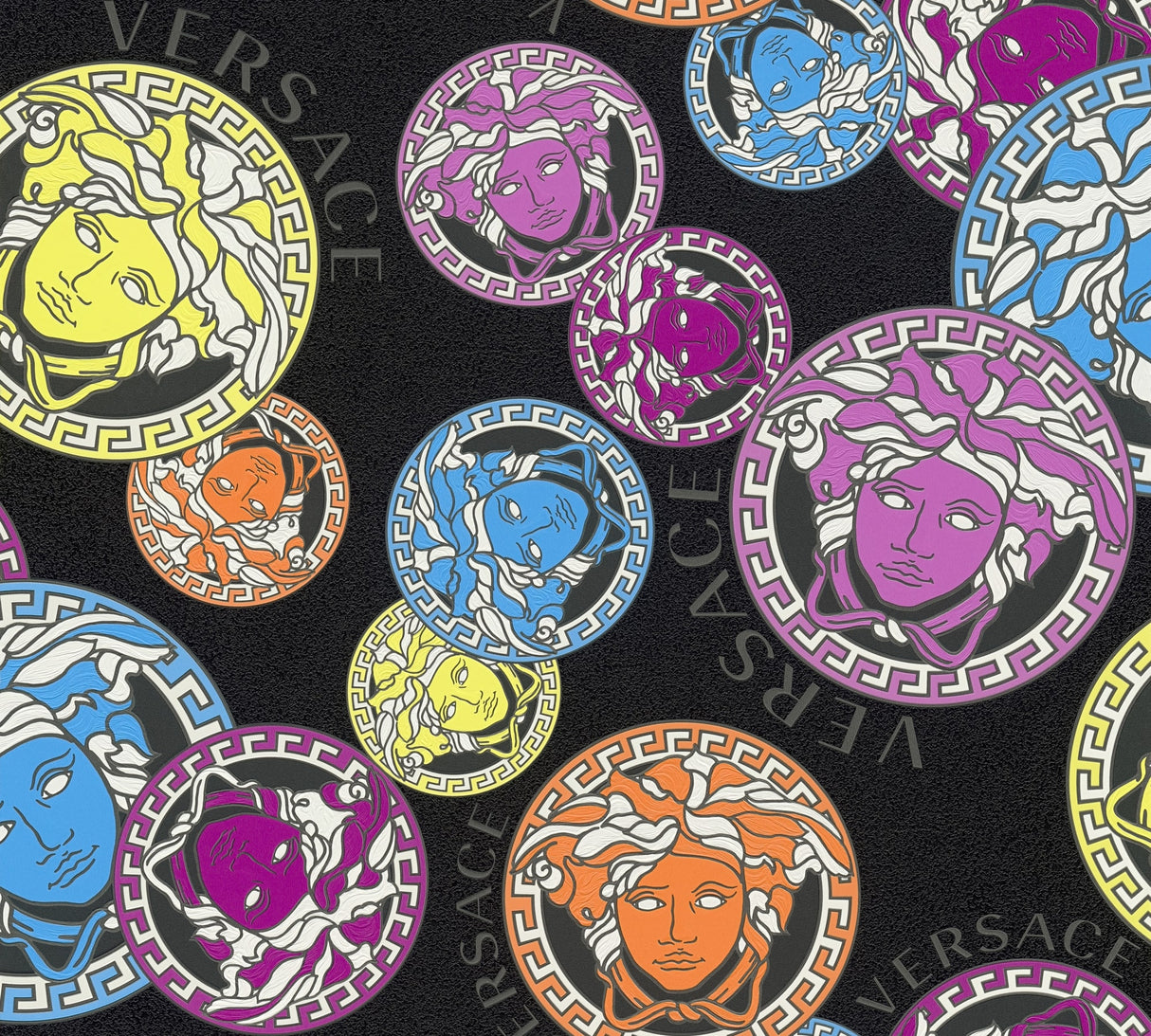Versace Dynasty wallpaper in Galaxy colorway featuring colorful Medusa-style medallions on a black textured ground.