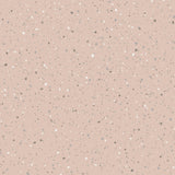 Johan Petal by Boråstapeter, a splatter-paint dotted wallpaper in soft pink tones, shown in detail and styled interior.