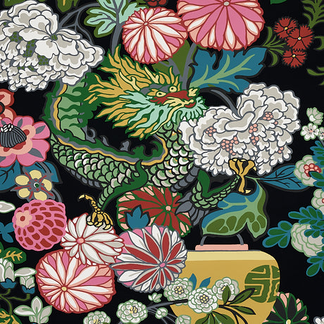CHIANG MAI DRAGON Ebony wallpaper by Schumacher featuring a vibrant chinoiserie dragon and floral motif on a black background.
