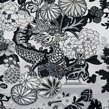 Chiang Mai Dragon Smoke wallpaper by Schumacher featuring a bold chinoiserie dragon and floral motif in black, white, and grey tones.