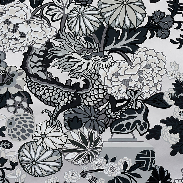 Chiang Mai Dragon Smoke wallpaper by Schumacher featuring a bold chinoiserie dragon and floral motif in black, white, and grey tones.