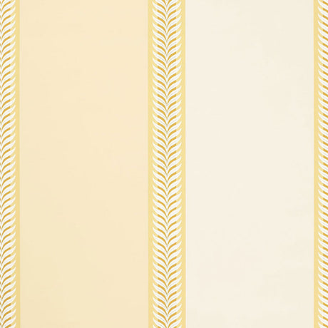 Valais Stripe wallpaper in soft yellow with alternating wide stripes and laurel leaf borders by Schumacher.