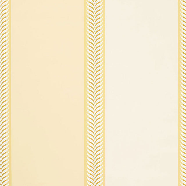 Valais Stripe wallpaper in soft yellow with alternating wide stripes and laurel leaf borders by Schumacher.