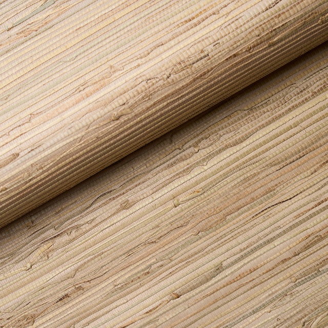 Close-up of Schumacher Nami Rushcloth natural textured wallcovering in cork colorway, showing open weave and organic fibers.