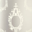 Go Baroque Mirror wallpaper with ornate baroque frame motifs in a reflective silver and white colorway by Schumacher.