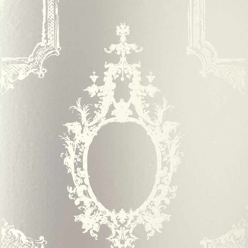 Go Baroque Mirror wallpaper with ornate baroque frame motifs in a reflective silver and white colorway by Schumacher.