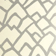 Zimba Silver geometric abstract wallpaper by Schumacher shown in a modern living room interior.