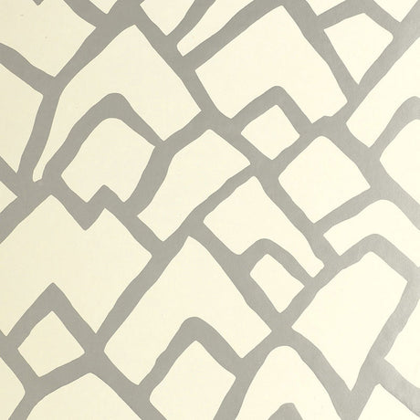 Zimba Silver geometric abstract wallpaper by Schumacher shown in a modern living room interior.