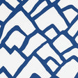 Zimba Marine hand-printed geometric wallpaper by Schumacher shown in a modern living room interior.