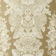 Champagne lace damask wallpaper with intricate hand screen printed pattern by Schumacher.