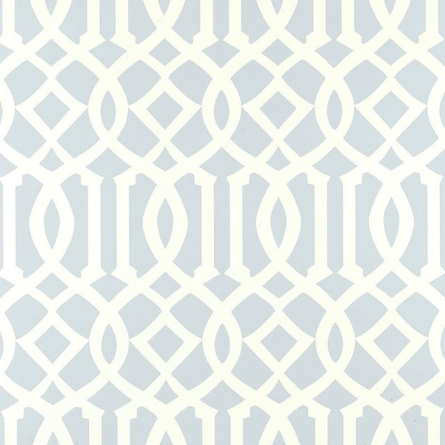Imperial Trellis Soft Aqua by Kelly Wearstler for Schumacher - geometric trellis pattern wallpaper in a serene blue and white colorway, styled in a bedroom interior.