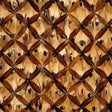 Wellesley Tiger's Eye by Schumacher - a luxurious wallcovering panel featuring hand-applied natural feathers in a textural lattice pattern.