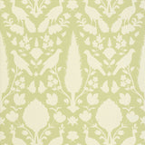 Chenonceau Sage wallpaper by Schumacher featuring enchanting flora and fauna silhouettes in a damask-inspired pattern.