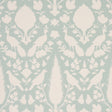 Chenonceau Aquamarine wallpaper by Schumacher featuring white flora and fauna silhouettes on a soft aquamarine background.