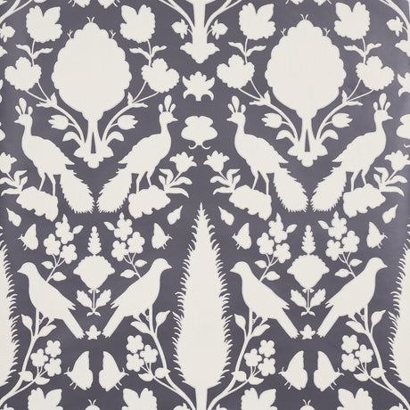 Chenonceau Charcoal wallpaper by Schumacher featuring white flora and fauna silhouettes on a charcoal background.