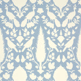 Chenonceau Sky wallpaper by Schumacher featuring a blue and white damask pattern with birds and flora.