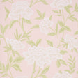 Whitney Floral blush wallpaper with large-scale Chinoiserie-inspired blossoms and green leaves on a pink background.